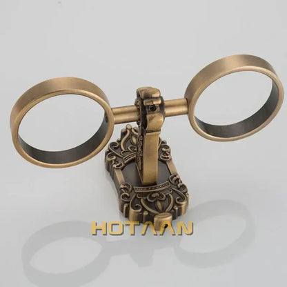 Decorbites aluminium double tumbler holder in antique brass color with steampunk dual-ring design and engraved base