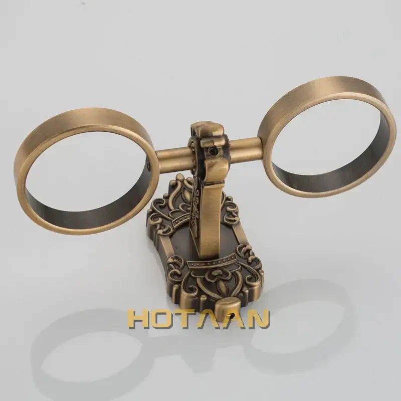 Decorbites aluminium double tumbler holder in antique brass color with steampunk dual-ring design and engraved base