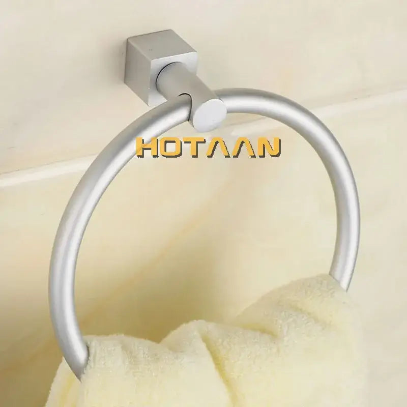 Silver-toned aluminium round towel holder with square wall-mounted base for bathroom towel holder rings by DecorBites