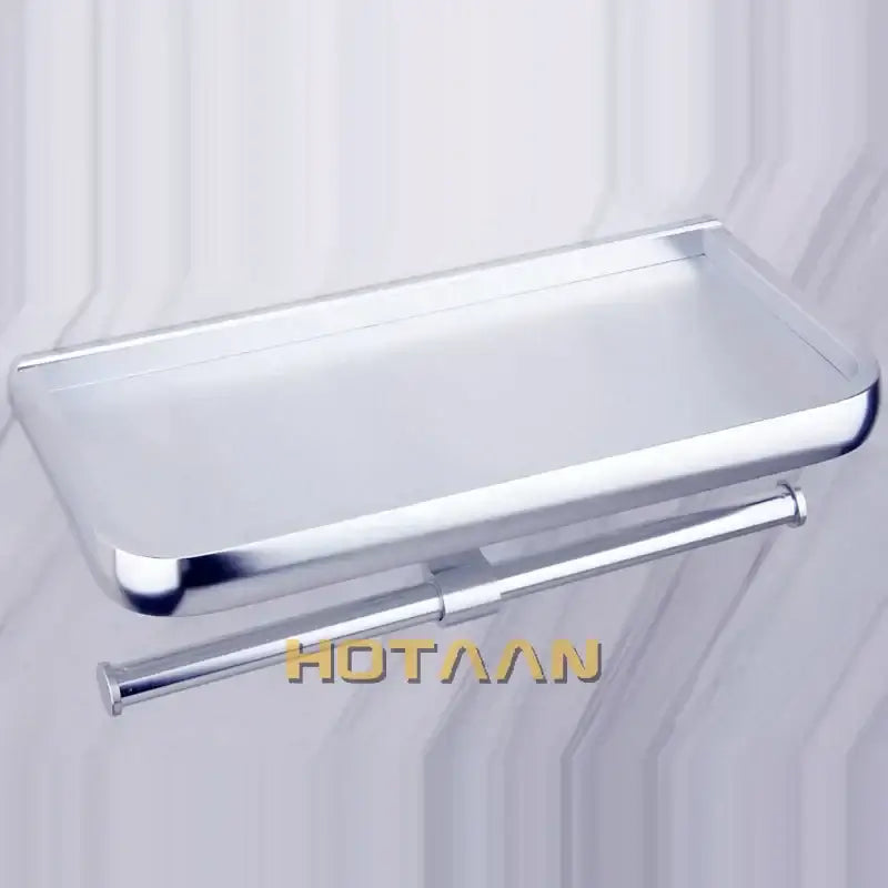 Chrome-finished aluminium decorbites™ toilet paper holder with shelf and integrated towel rod for bathroom use