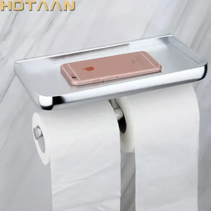 Chrome finished dual-roll aluminium toilet paper holder with integrated shelf holding rose gold iphone by decorbites