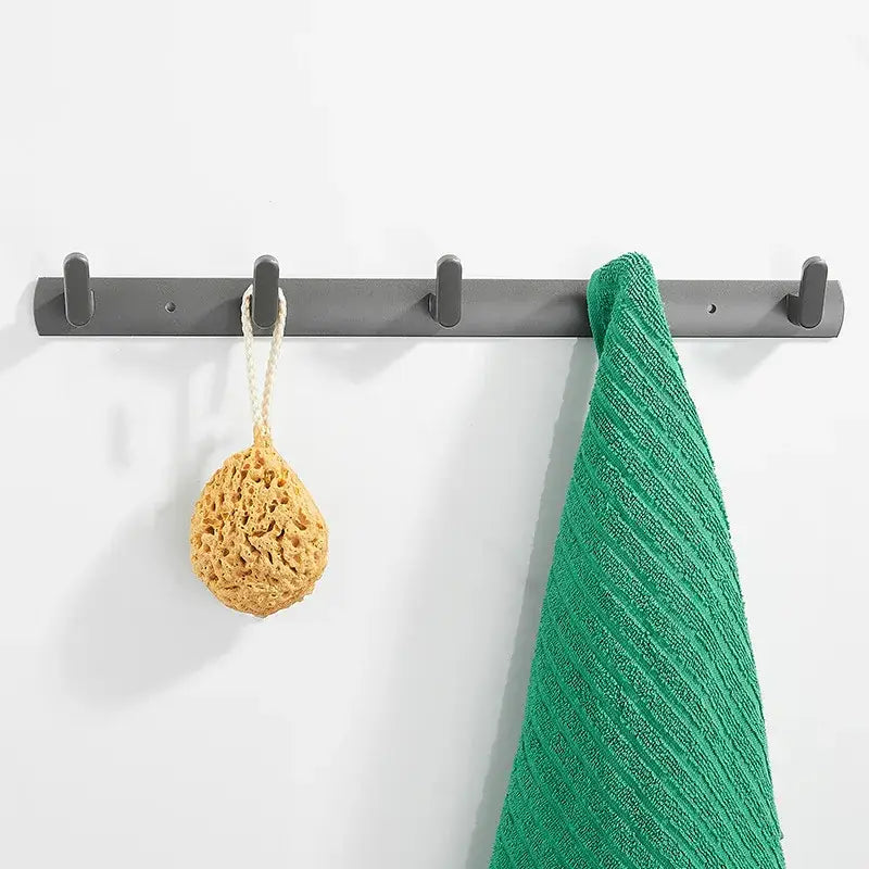 Gray aluminum alloy towel hooks wall mounted rack with five hooks holding green towel and yellow loofah