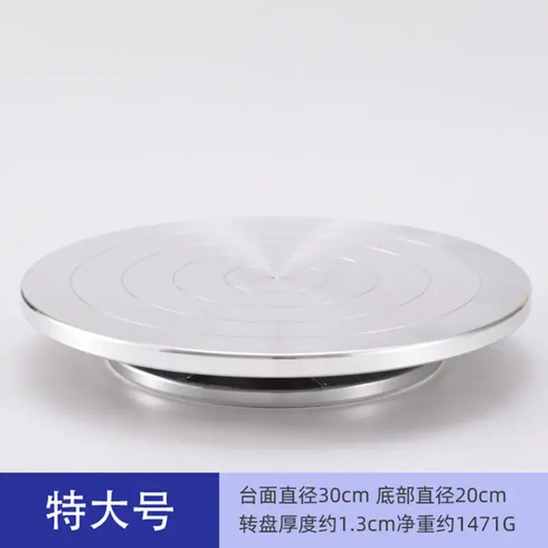 Silver metallic aluminum alloy turntable with concentric grooves for clay sculpture and pottery wheel rotation by DecorBites