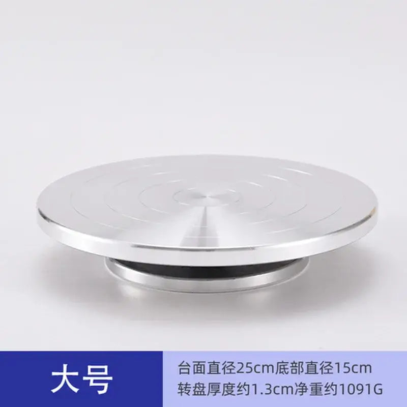Decorbites™ aluminum alloy turntable with silver metallic finish and concentric grooves for clay sculpture rotation