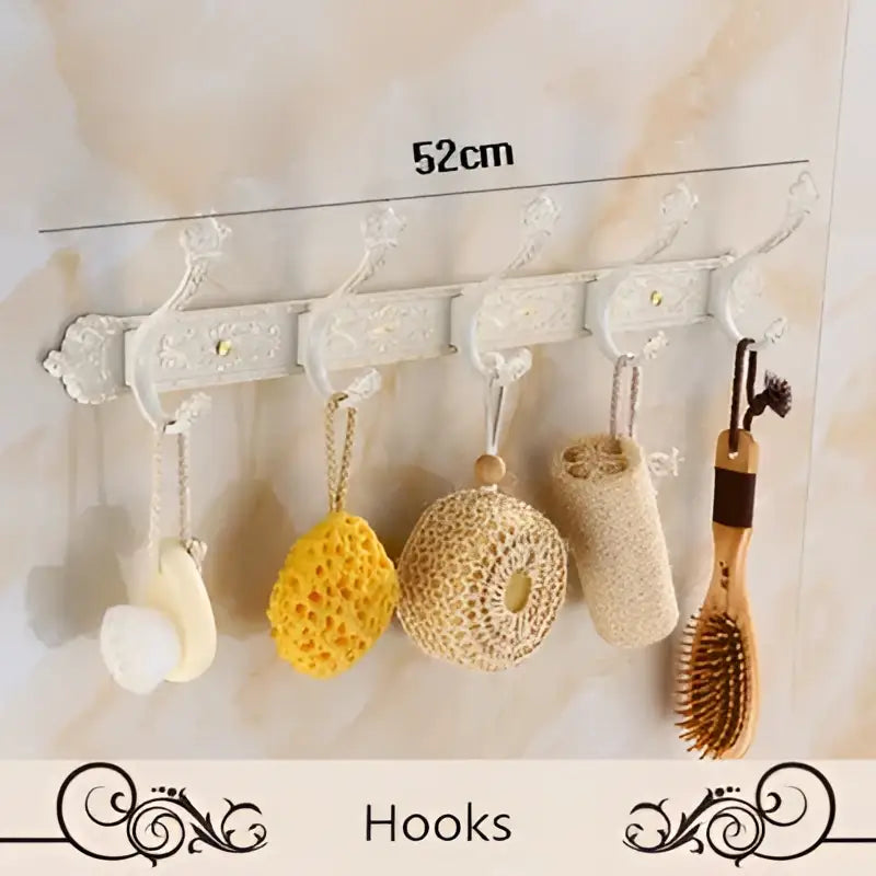 Decorbites aluminum white ornate wall-mounted bath hardware set with five decorative hooks holding bath items