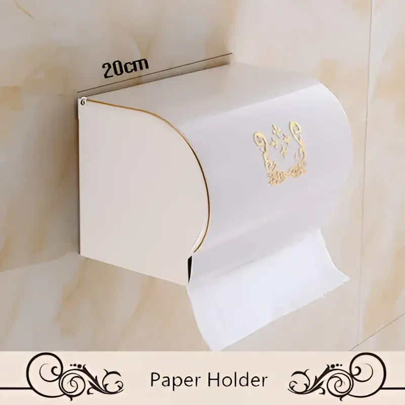 White wall-mounted aluminum paper holder with gold ornate detailing from decorbites bath hardware set