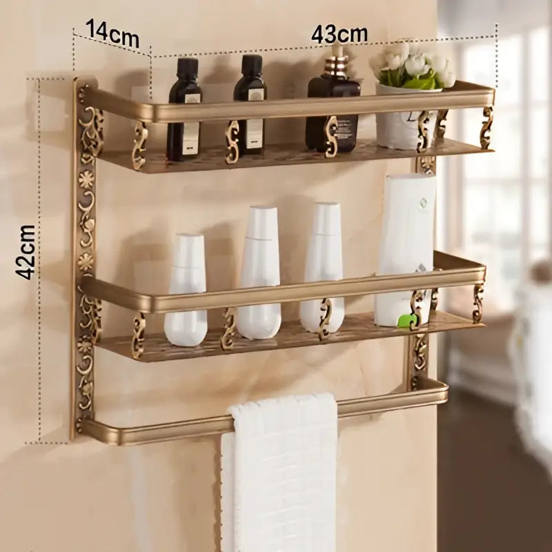 Antique brass two-tier bathroom corner shelf with ornate scrollwork and towel bar for shower room organization