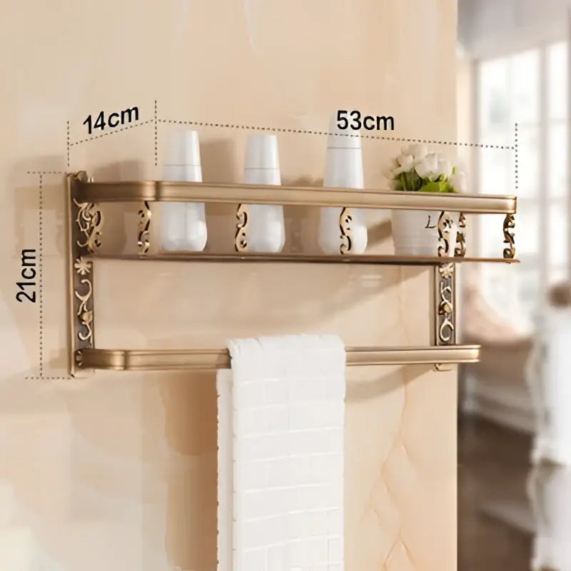 Brass-finished aluminum bathroom corner shelf with ornate scrollwork and towel bar for shower room organization