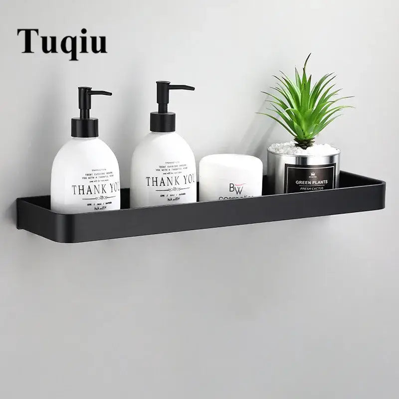 Decorbites™ black matte aluminum bathroom corner shelf wall mounted holding essentials and a small potted plant