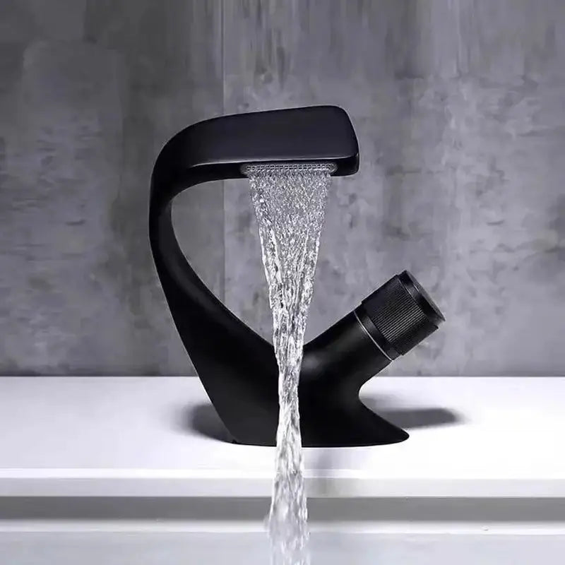 Black matte-finish modern faucet with curved waterfall spout paired with aluminum bathroom corner shelf for shower storage