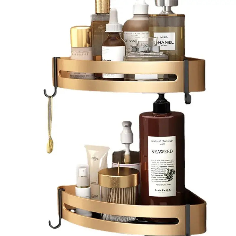 Gold-colored two-tiered aluminum bathroom corner shelf with sleek metal construction and black hooks for shower storage