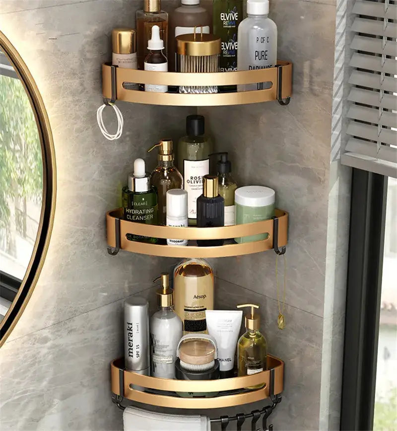 Gold-toned aluminum bathroom corner shelf with three tiers and black mounting brackets for shower storage holder