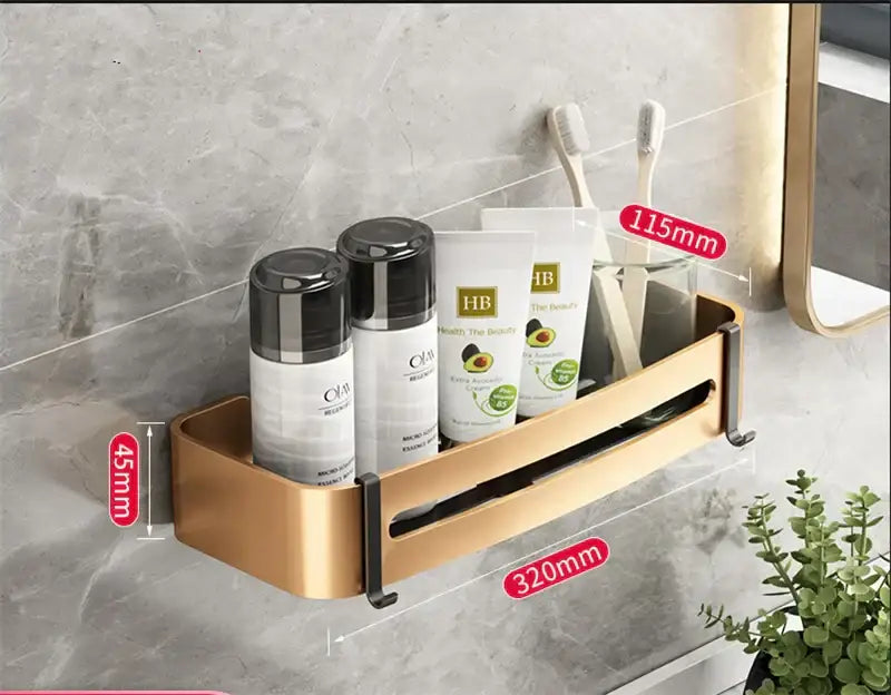 Gold-colored aluminum bathroom corner shelf with sleek modern design and black mounting brackets for wall storage