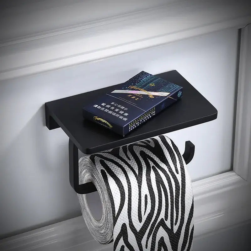 Black matte aluminum bathroom paper holder wall-mounted with phone holder and zebra-striped tissue paper roll