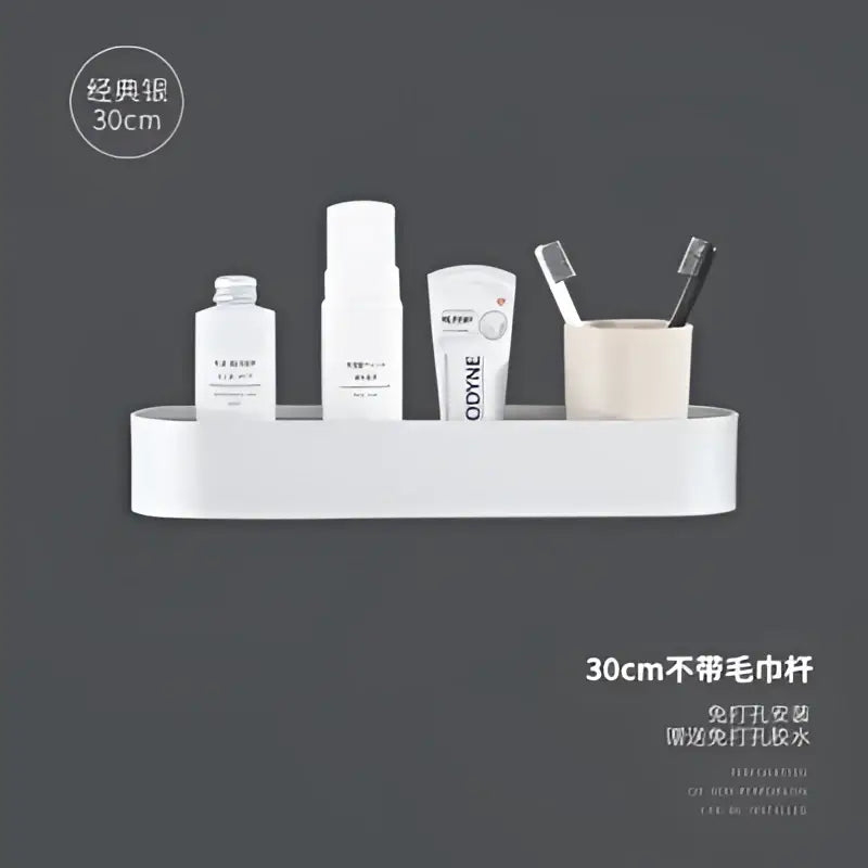 White aluminum bathroom shelf with towel bar mounted on wall holding toiletries for bath and shower organization