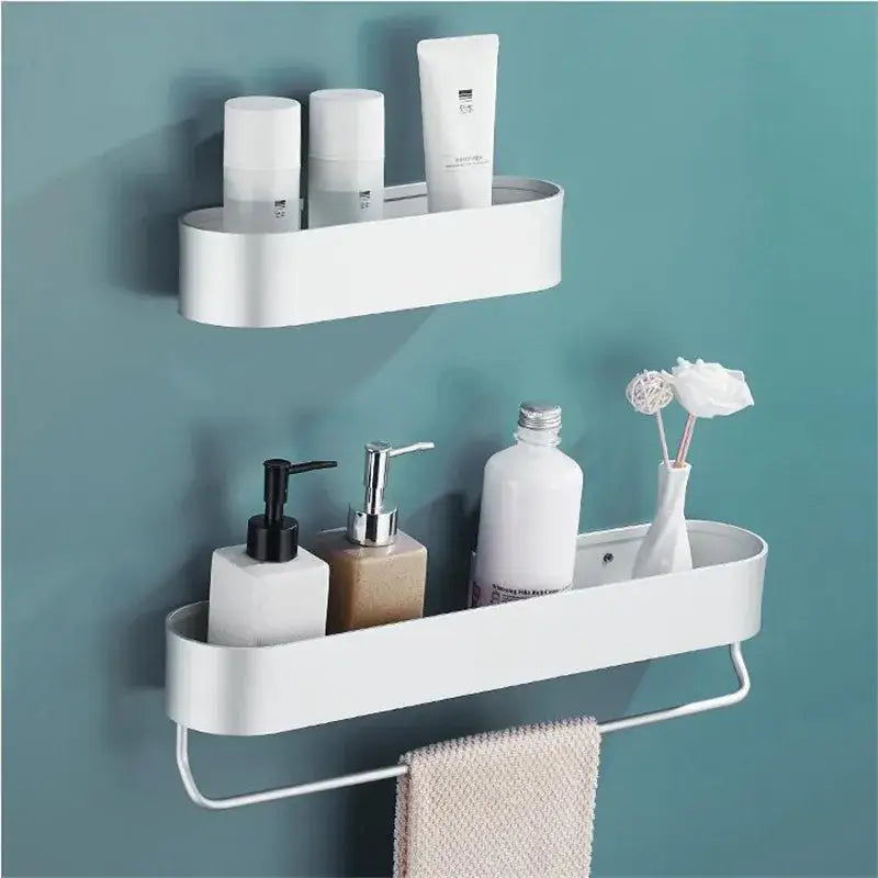 White sleek aluminum bathroom shelf with integrated towel rack for bath and shower organization by decorbites