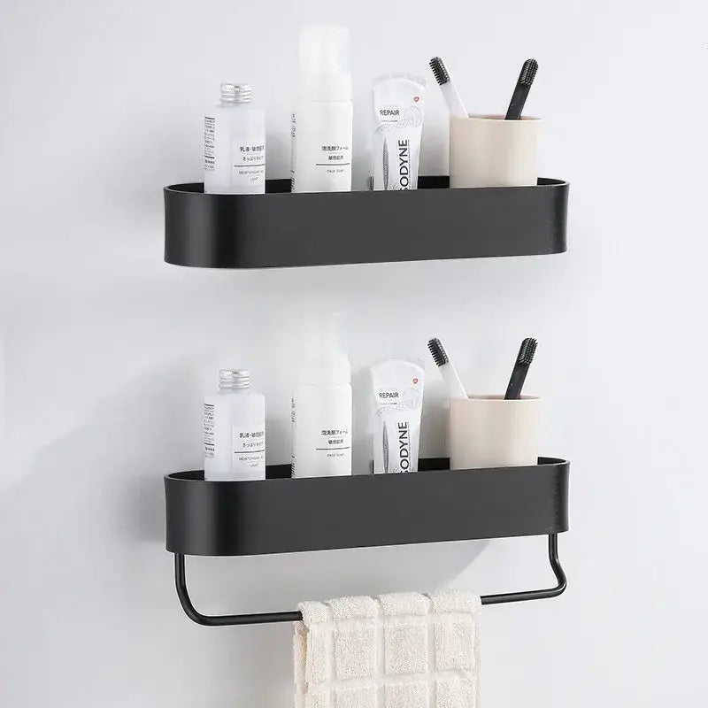 Black metal wall-mounted bathroom shelf with integrated towel rack for bath organization by DecorBites aluminum bathroom shelf