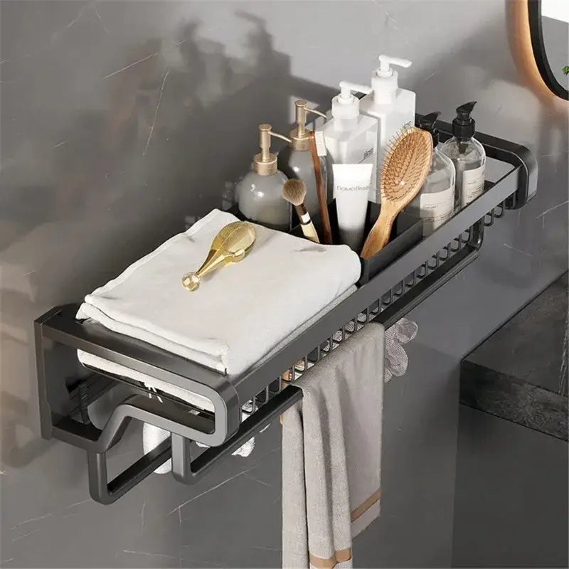 Black metal aluminum bathroom towel holder with hook and storage basket featuring a grid design holding toiletries and towels