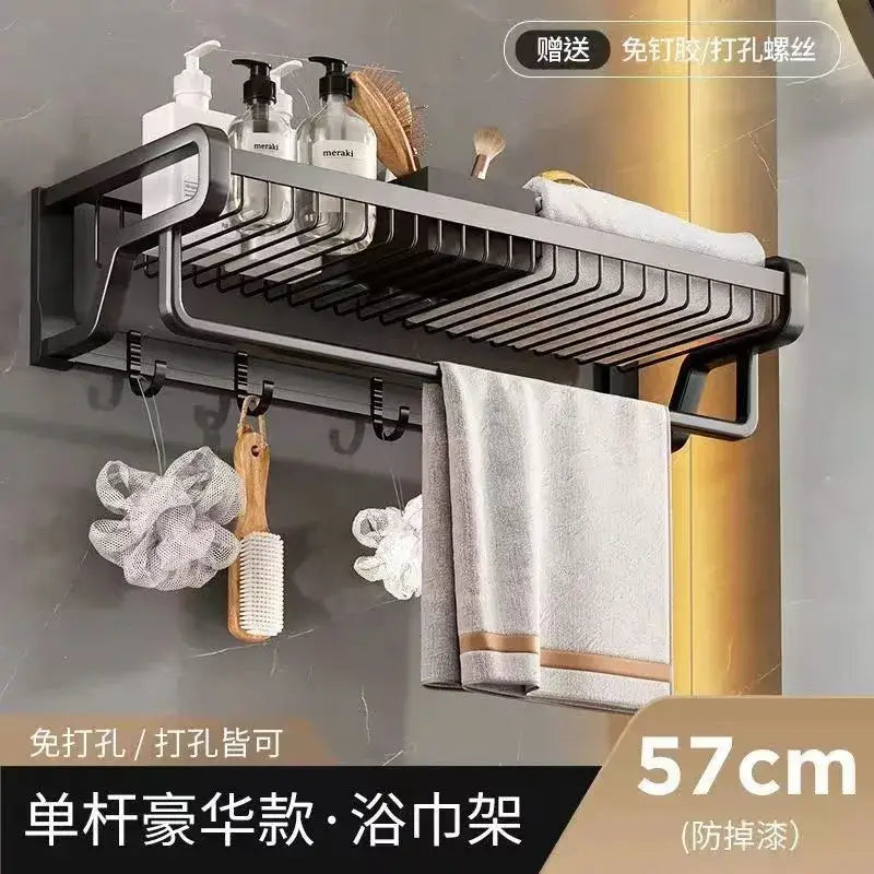 Black metal aluminum bathroom towel holder with storage basket and integrated shelf for toiletries by decorbites