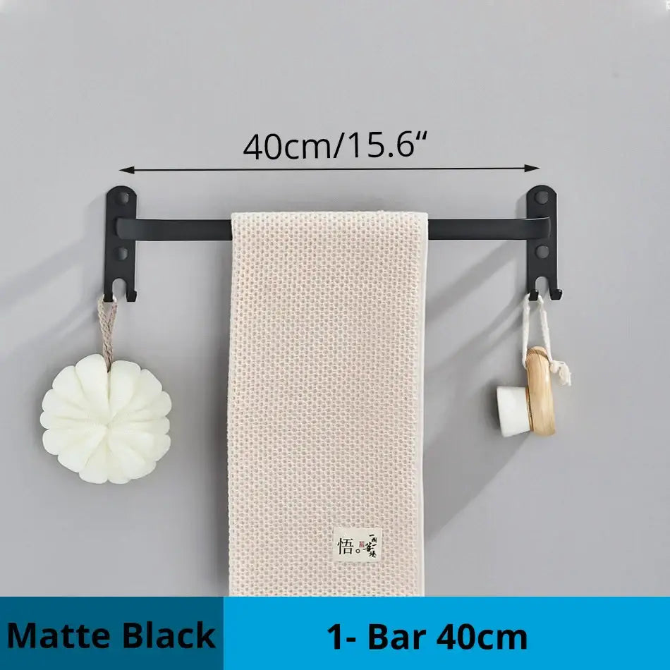 Matte black DecorBites™ aluminum bathroom towel rack wall mounted with hook holding textured off-white towel