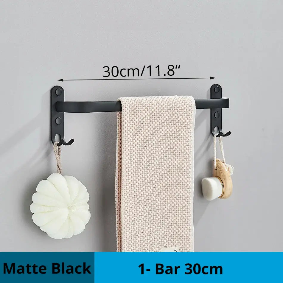 DecorBites™ matte black aluminum bathroom towel rack with two hooks and bar holding beige textured towel