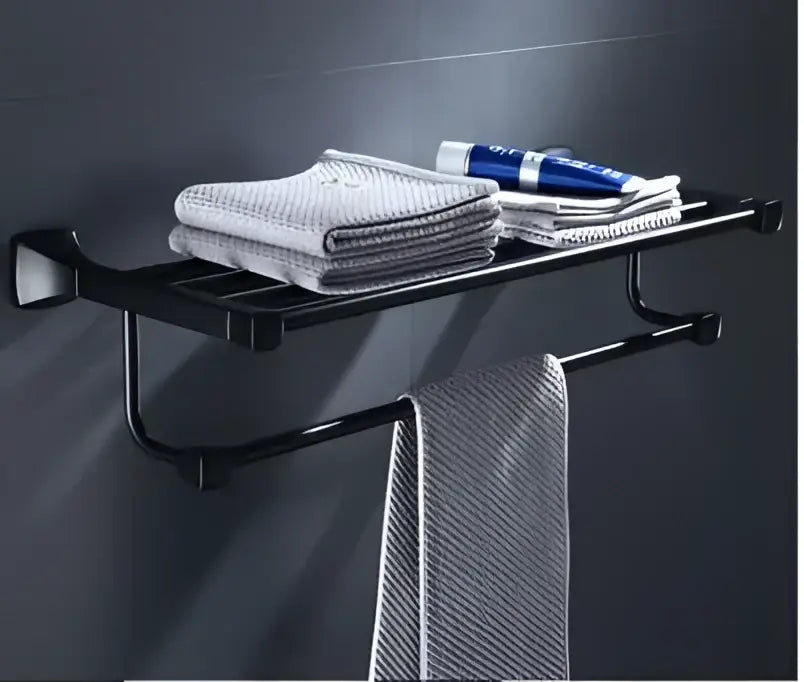 Black metal aluminum towel rack with modern design holding gray towels and toothpaste in bathroom hardware set