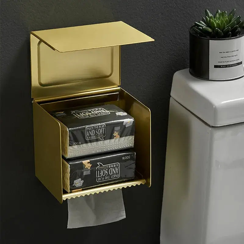 Gold-colored aluminum tissue box holder with hinged lid and scalloped edge for bathroom toilet paper storage