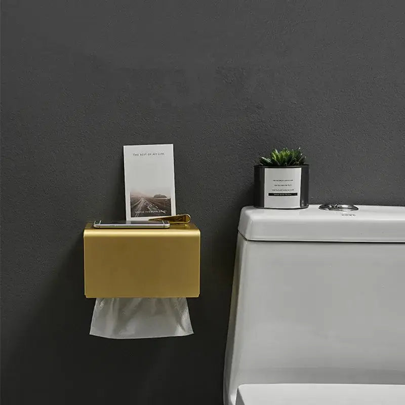 Gold-colored decorbites™ aluminum brushed gold toilet paper holder with sleek rectangular tissue box for bathroom use