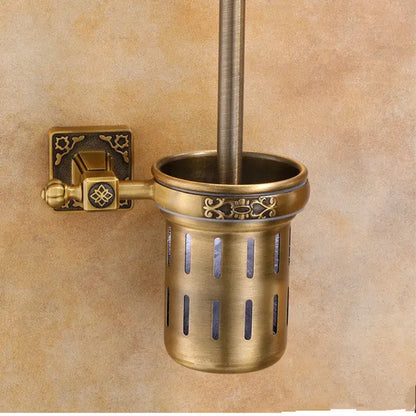 Antique brass decorbites aluminum carved toilet brush holder with ornate detailing and vertical slits for wall mounting