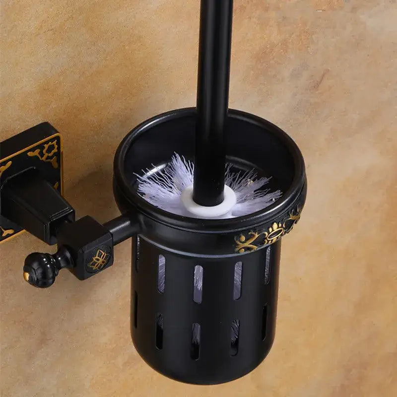 DecorBites™ aluminum carved black toilet brush holder with gold floral accents and white bristle toilet brush inside