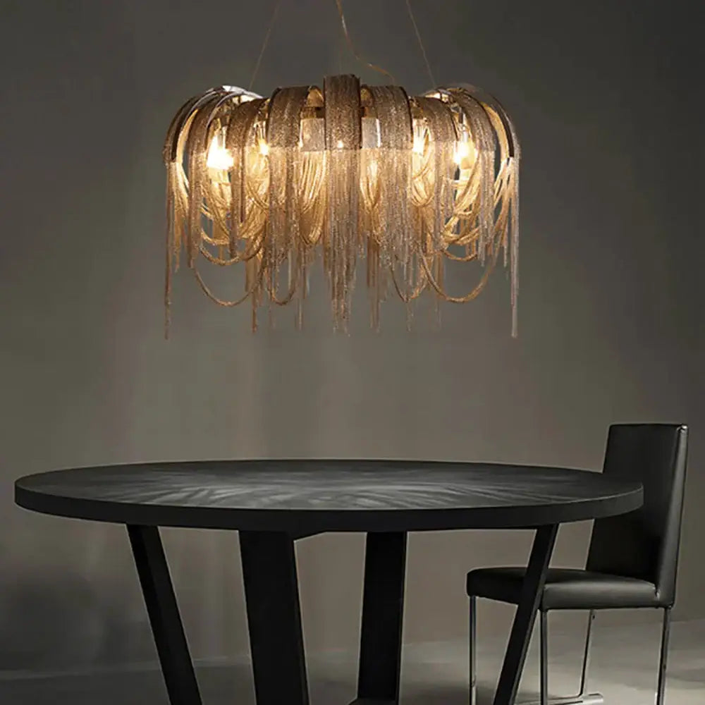 Golden aluminum chain pendant lights with textured metallic finish and intricate fringe for dining table decor