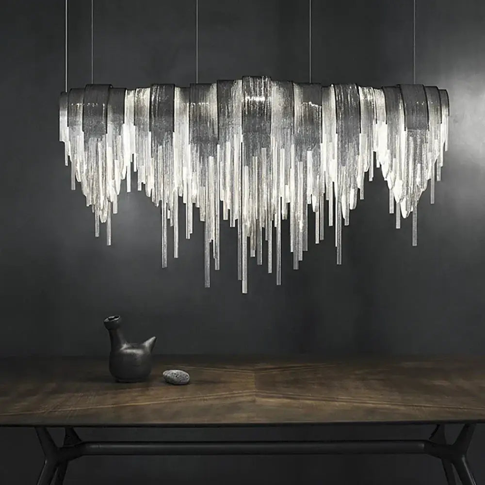 Silver metallic aluminum chain pendant light with cascading textured glass prisms for dining table lighting