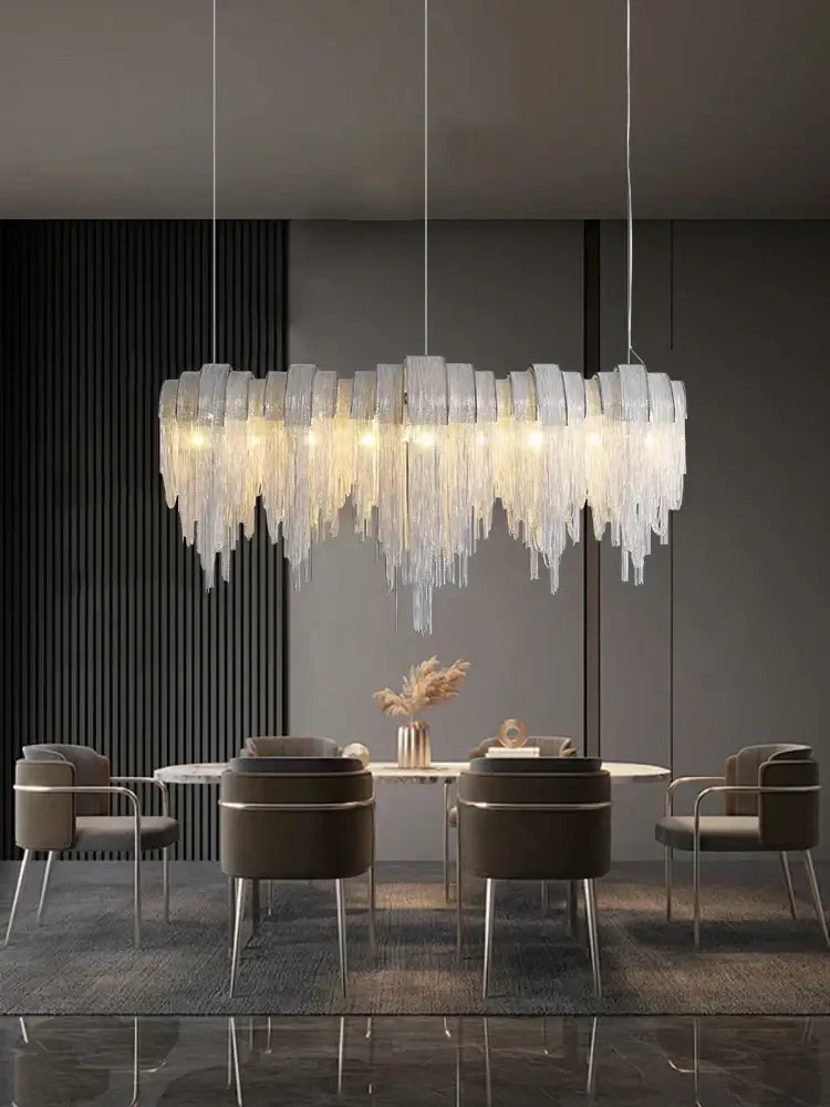 A modern aluminum chain pendant light with cascading translucent glass prisms for dining table lighting