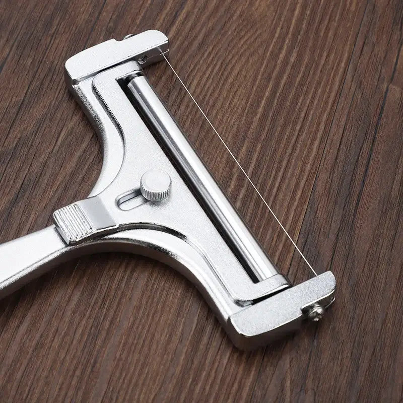 Silver aluminum cheese butter slicer with wire knife baking tool featuring a fine wire blade and adjustable tension knob