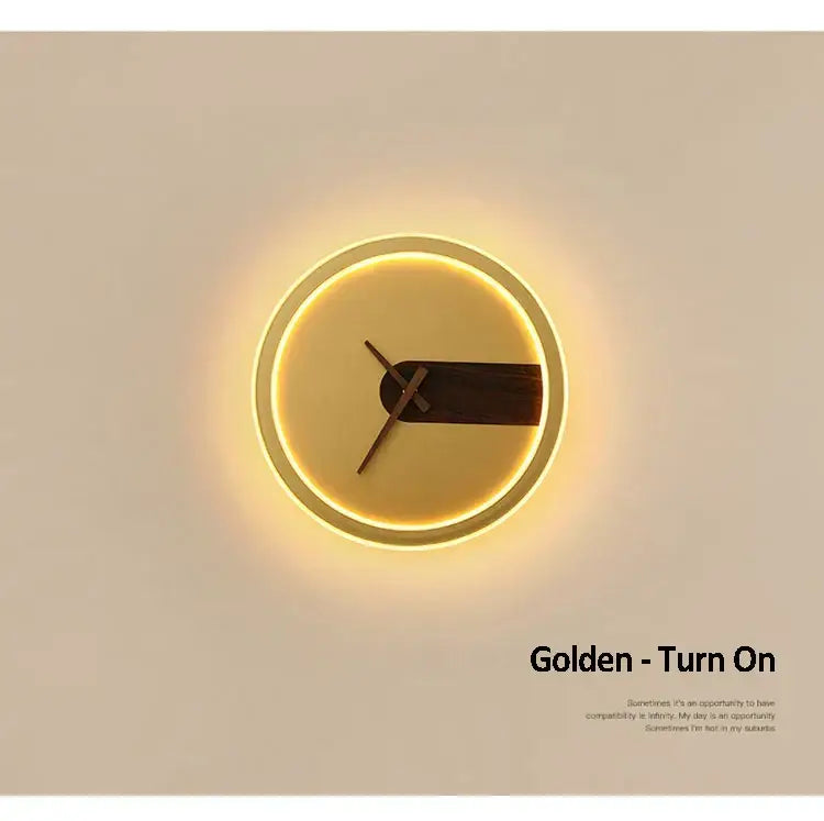 Modern aluminum clock wall lamp featuring a glowing golden frame, dark wood hands, and illuminated face for home use