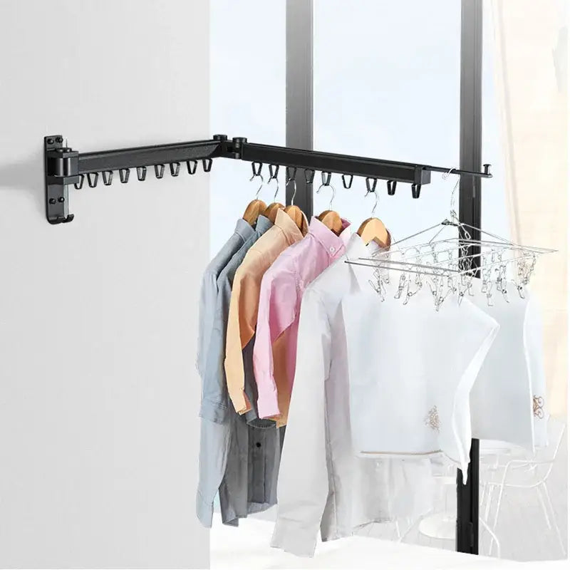 Black aluminum clothing hanger organizer rack with multiple hooks and foldable drying rack wall-mounted by decorbites