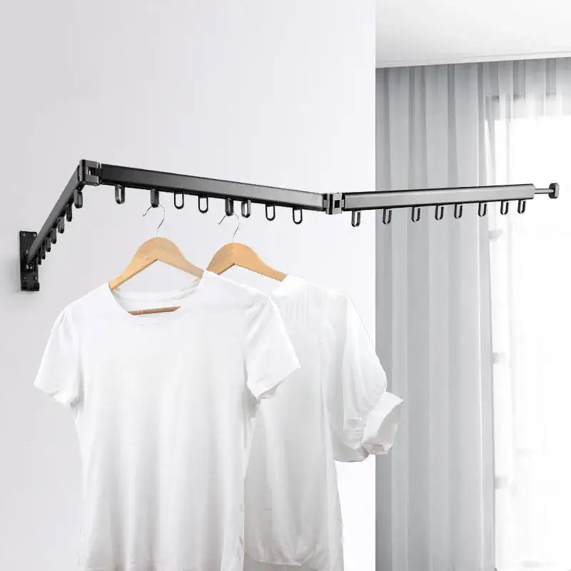 Black aluminum clothing hanger organizer rack with extendable wall-mounted foldable hooks holding wooden hangers