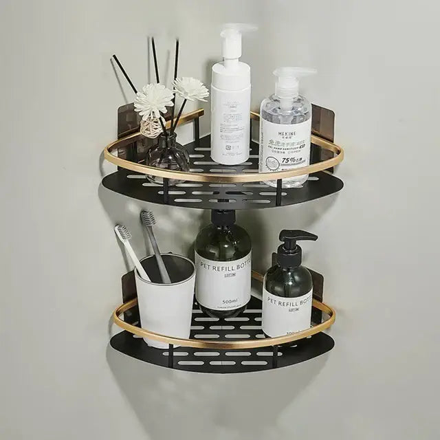 Black and gold aluminum corner bathroom shelf with perforated design and towel holder by decorbites