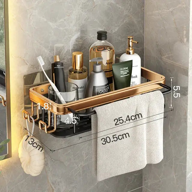 Gold-toned aluminum corner bathroom shelf with black accents featuring towel rack and hooks for organizing toiletries