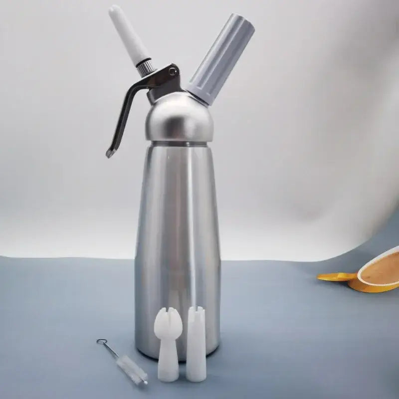 Silver aluminum cream gun chantilly siphon dispenser with white and gray attachments for kitchen foaming tasks