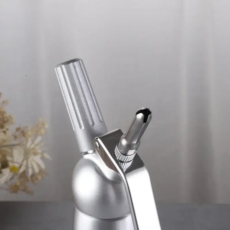 Silver metallic aluminum cream gun with ribbed handle and interchangeable nozzle for decorbites cream gun chantilly use