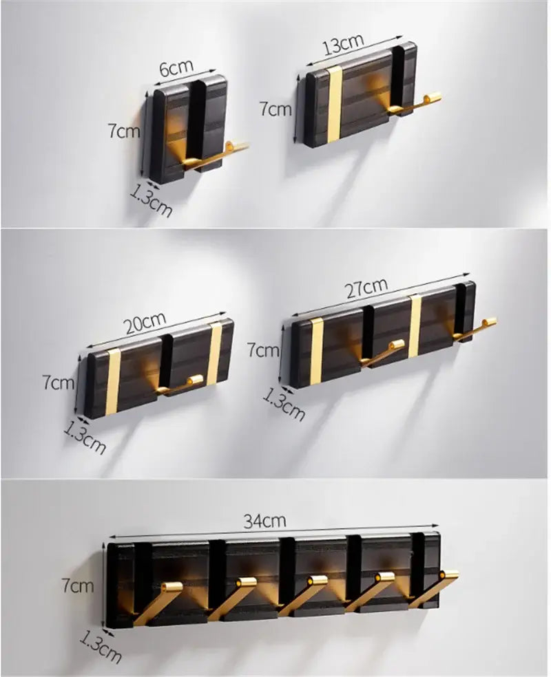Modern black and gold aluminum folding robe hook with sleek minimalist design for wall mount by DecorBites