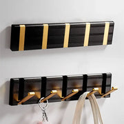 Black and gold aluminum folding robe hook wall mount with five hooks for coat and towel hanging by DecorBites™
