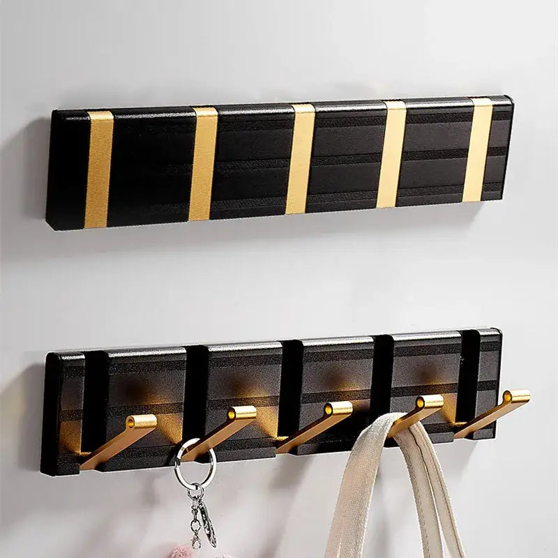 Black and gold aluminum folding robe hook wall mount with five hooks for coat and towel hanging by DecorBites™