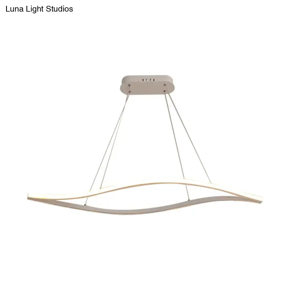 Modern white led pendant light with a sleek, curved design and thin suspension cords.