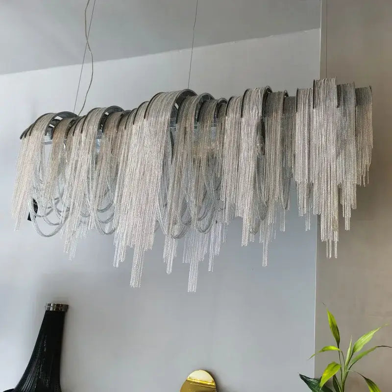 Silver aluminum led chandelier with cascading textured strands and modern sculptural design for living room decor