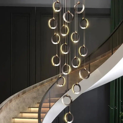 DecorBites aluminum led chandelier with polished metallic rings emitting warm light ideal for staircase and attic lighting