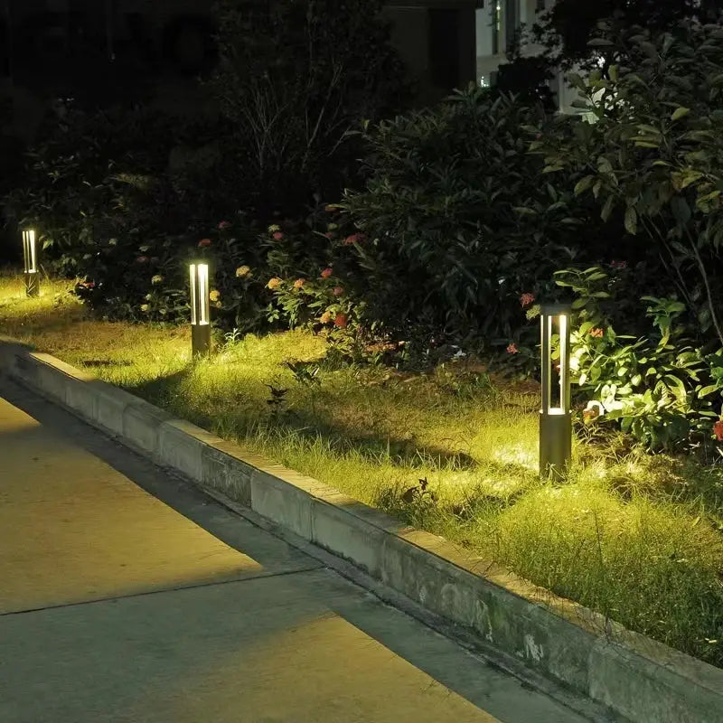 DecorBites aluminum led garden light with sleek matte black cylindrical design and warm yellow landscape lamp illumination