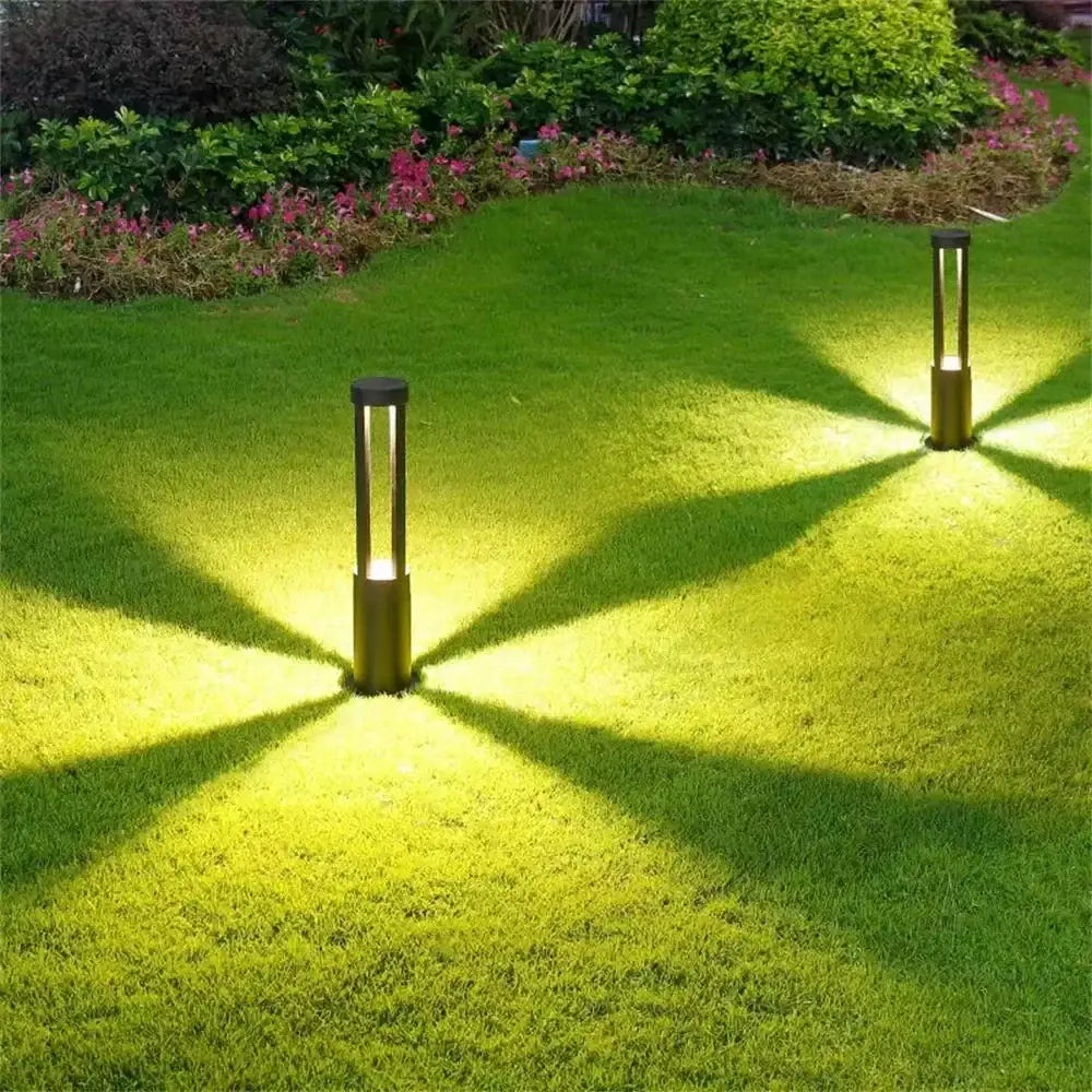 Modern gold-toned aluminum led garden light with clear glass panels and warm illumination for outdoor landscape lamp use