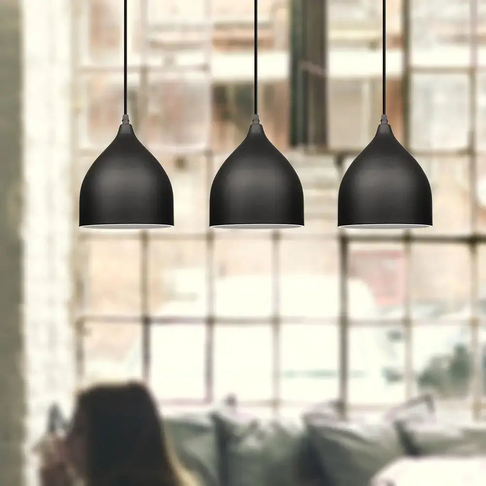 Three sleek black aluminum led pendant lights with matte finish in modern nordic design for kitchen and bedroom use